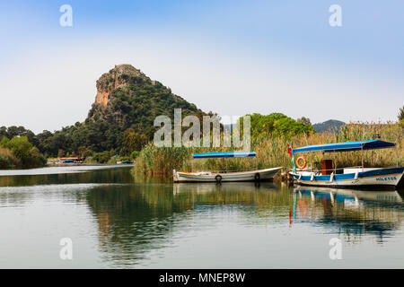 Traditional old canopied fishing boats on Dalyan river in Mugla province, Turkey. Stock Photo