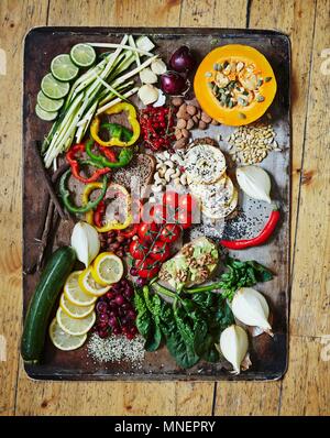 Various vegetables on a vintage tray Healthy greens Stock Photo