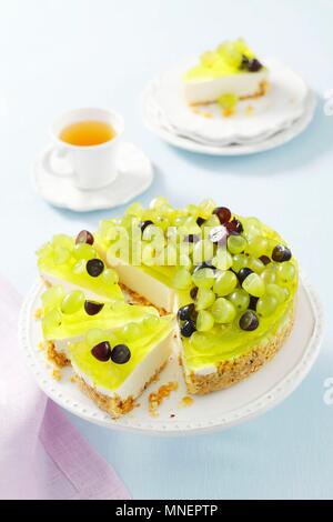 Yoghurt torte with jelly and grapes Stock Photo