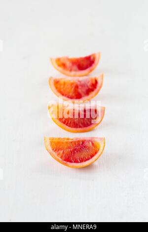 Blood orange slices in a row Stock Photo
