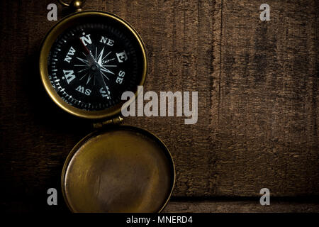 Compass on aged wood table Stock Photo