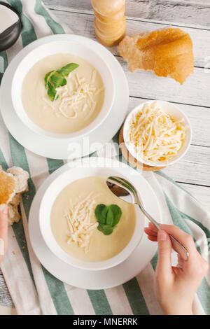 Cheese soup with watercress Stock Photo