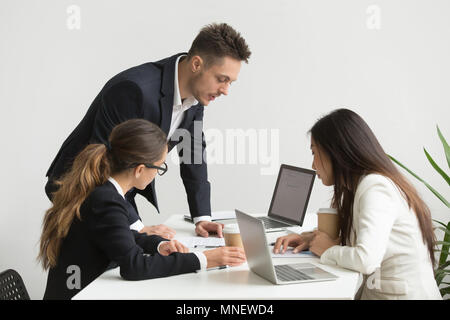 Company workers brainstorming during board meeting Stock Photo