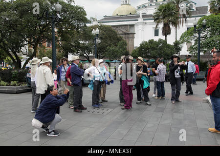 A group of north american tourists visiting the Plaza Grande in Quito Ecuador Stock Photo