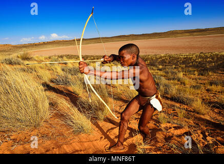 Bushman of the San people hunting, !Xaus Lodge, Kalahari or Kglagadi Transfrontier Park, Northern Cape, South Africa Stock Photo