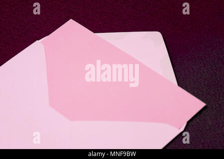 Blank pink card in opened pink envelope Stock Photo