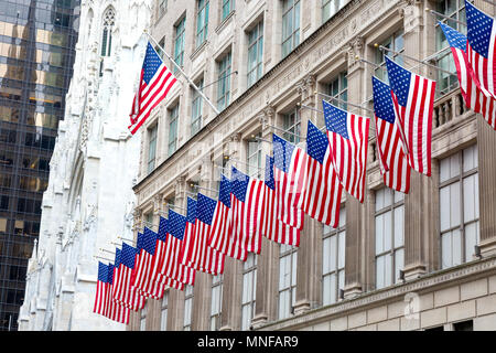 American flags on the front of Saks Fifth Avenue department store, 5th Avenue, New York city USA Stock Photo