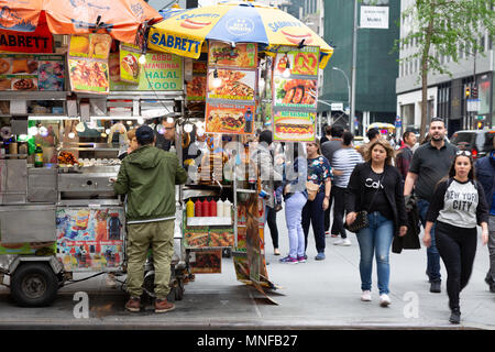 New York street food stand selling halal food, W54th street and Fifth Avenue junction, New York city USA Stock Photo