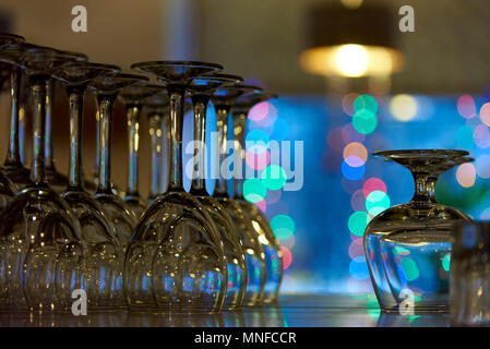 Empty glasses on a shelf in the background of a bokeh Stock Photo