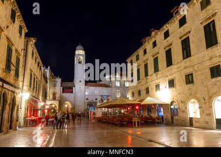Night time view looking east down Stradun (main street) towards the clock tower, in the Old City of Dubrovnik, Croatia. Stock Photo
