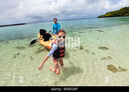 Father and daughter kayaking at tropical ocean Stock Photo