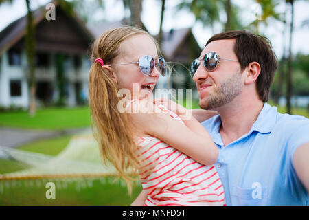 Happy family father and his adorable little daughter on vacation taking selfie Stock Photo