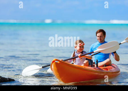 Father and daughter kayaking at tropical ocean Stock Photo