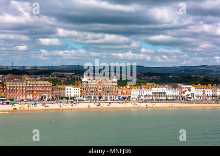 Weymouth in Dorset, UK, sandy beach with Georgian architecture panorama view in sunny Summer day. Full frame horizontal view from top of seaside Stock Photo
