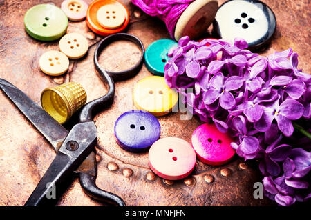 Set buttons from clothes, threads and scissors.Sewing accessories. Stock Photo
