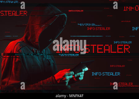 concept with faceless hooded male person, low key red and blue lit image and digital glitch effect Stock Photo
