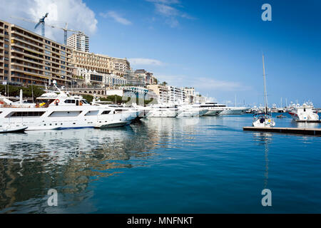 Monaco, Monte-Carlo - May 8, 2010: Monaco Harbour full of luxury boats on a warm summer day Stock Photo