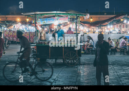 MARRAKECH, MOROCCO, JUNE 2016: street vendor sleeping in his cariage on the streets of the old market djama el-Fna Stock Photo