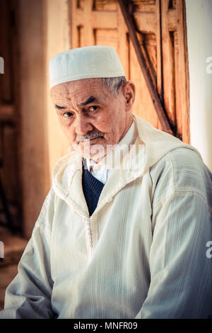 MARRAKESCH, MOROCCO, JUNE 2016: old moroccan in traditional clothes on the city streets Stock Photo