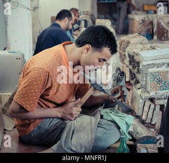 FEZ, MOROCCO, JUNE 2016: traditional pottery worker on the streets in the old Medina Stock Photo