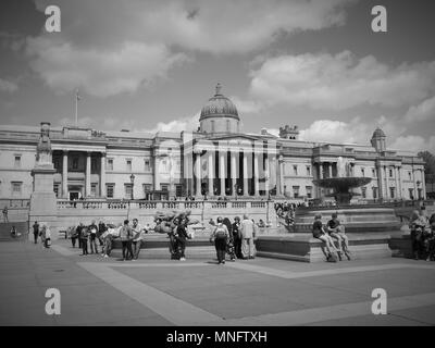 LONDON - MAY 10, 2018: ( Image digitally altered to monochrome ) Fourth Plinth on a sunny day in Trafalgar Square The Invisible Enemy Should Not Exist Stock Photo