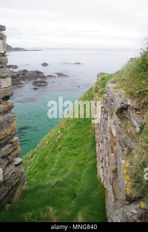 Inviting Turquoise Water of the Rugged Coast by Findlater Castle, Sanded, Scotland, UK. Stock Photo