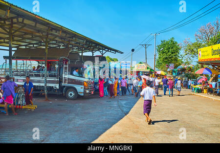 KYAIKTIYO, MYANMAR - FEBRUARY 16, 2018: The crowd at the truck station, pilgrims and tourists arrive and departure from the Golden Rock Buddhist Templ Stock Photo