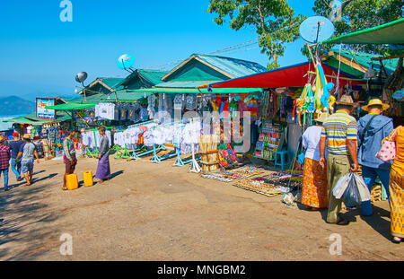 KYAIKTIYO, MYANMAR - FEBRUARY 16, 2018: The souvenir market stretches along the hilly street, leading to the Golden Rock Buddhist Temple, on February  Stock Photo