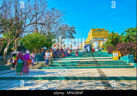 KYAIKTIYO, MYANMAR - FEBRUARY 16, 2018: The large complex of Kyaiktiyo Pagoda includes Image Houses, Stupas and Shrines along the hilly road to the ma Stock Photo