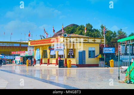 KYAIKTIYO, MYANMAR - FEBRUARY 16, 2018: The store of Kyaiktiyo Pagoda sells the golden leaves to affix them on face of Golden Rock - traditional ritua Stock Photo