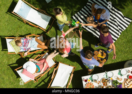 Friends having summer garden party, top view Stock Photo