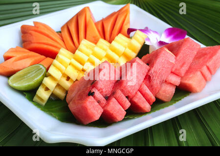 In Mix fruits have Watermelon, Papaya and pineapple on dish. Stock Photo