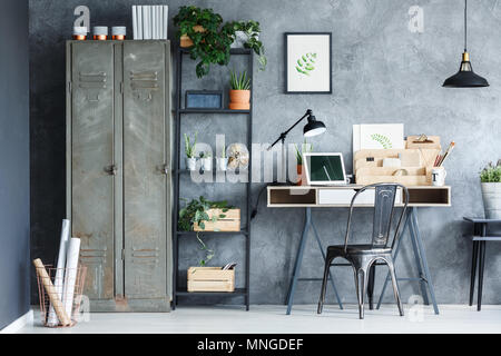 Atelier of a freelancer artist with stylish botanical posters Stock Photo