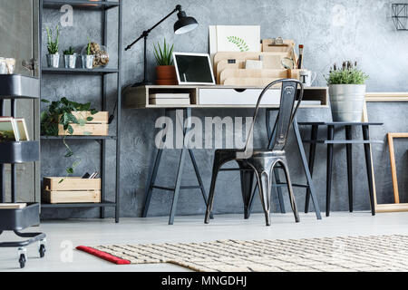 Retro furniture, rack, cart, lamp and desk in office room Stock Photo
