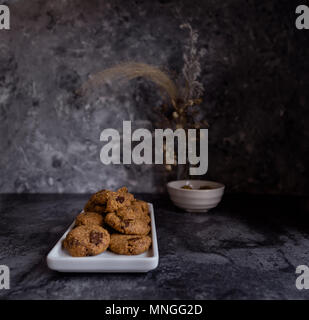 Hazelnut Chocolate Chip Cookies, Dark Background Stock Photo