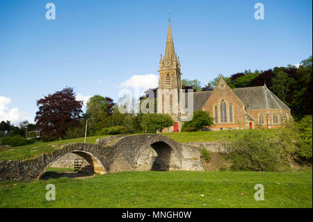 Subscription Bridge, Stow with St Mary of Wedale Church behind.  Also known as Packhorse bridge. Stock Photo