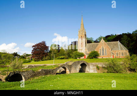 Subscription Bridge, Stow with St Mary of Wedale Church behind.  Also known as Packhorse bridge. Stock Photo