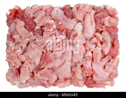Fresh pork  fillet heap is cut into small pieces for making minced meat on a grinder lie on table.  Isolated on white. Studio macro food shot Stock Photo