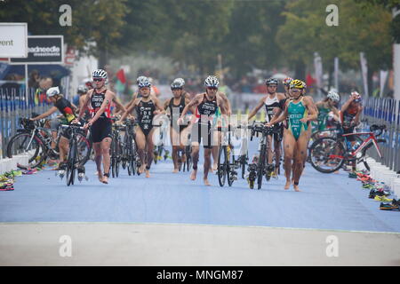 Non Stanford, Emma Moffatt and Jodie Stimpson enter the transition zone during the Elite Women's race at the PRUHealth World Triathlon Grand Final in London - London, 12 September 2013 --- Image by © Paul Cunningham Stock Photo