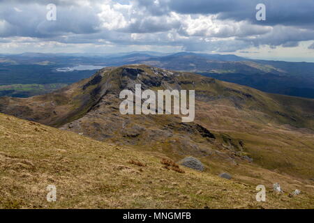 The rugged summit of Moelwyn Bach viewed from the summit of Moelwyn mawr with Llyn Trwasfynydd in the background Stock Photo
