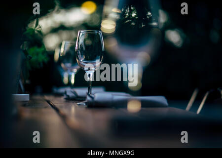 Luxury table settings for fine dining with and glassware, beautiful blurred  background. For events, weddings and other social events. Stock Photo