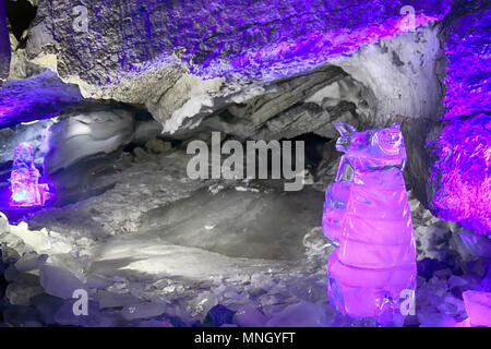 Great ice cavern. Kungur ice cave, ice glen. Perm Krai. Russia. Magnificent ice stalactites blue, clear dark-blue ice Stock Photo