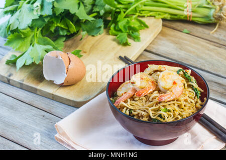 crawfish on fried noodles in cup, chopsticks, Stock Photo