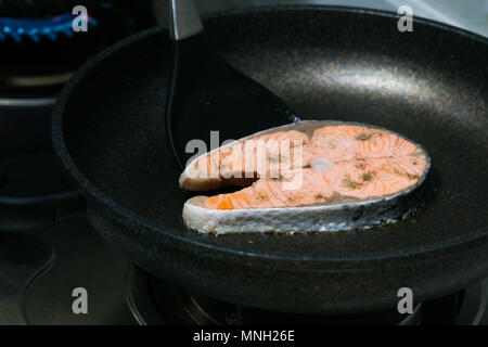 grilled fish salmon fillet on the pan Stock Photo