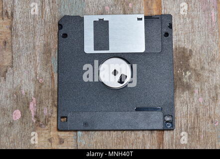 black floppy disk on wood board Stock Photo