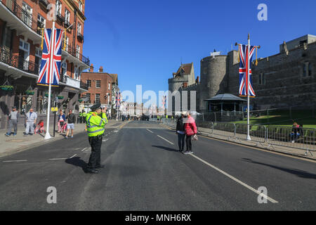 London UK. 17th May 2018. A policeman takes pictures of tourists in Windsor ahead of the dress rehearsals for the Royal Wedding beween Prince Harry and Meghan Markle Credit: amer ghazzal/Alamy Live News Stock Photo