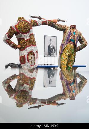 17 May 2018, Germany, Dresden: The sculpture 'How to Blow Up Two Heads at Once' by Yinka Shonibare in the exhibition 'Racism. The Invention of Human Races' at the German Hygiene Museum. The exhibition is set to run from 19 May 2018 until 06 January 2019. Photo: Sebastian Kahnert/dpa Stock Photo