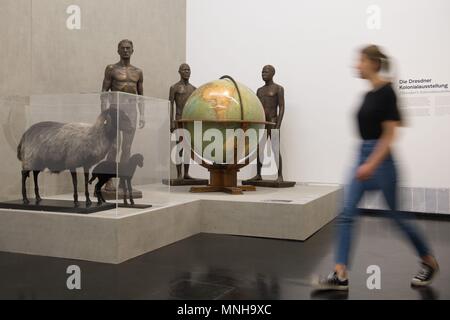17 May 2018, Germany, Dresden: A museum employee walks through the exhibition 'Racism. The Invention of Human Races' at the German Hygiene Museum. The exhibition is set to run from 19 May 2018 until 06 January 2019. Photo: Sebastian Kahnert/dpa Stock Photo