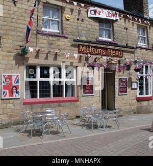 Buxton. Derbyshire. UK. 17th May. 2018. Miltons Head public house puts out the bunting to celebrate the royal wedding between Prince Harry and  Meghan Markle on the 19th. Credit: John Fryer/Alamy Live News