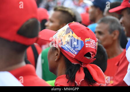 Caracas, Distrito Capital, Venezuela. 17th May, 2018. A woman seen wearing a cap with the portraits of Nicolas Maduro and Hugo Chavez during the rally.Supporters gathered to hear President Nicolas Maduro's speech during his last electoral campaign in Av Bolivar, Caracas, few days before the presidential election held on May 20th 2018. Credit: RomÃ¡N Camacho/SOPA Images/ZUMA Wire/Alamy Live News Stock Photo